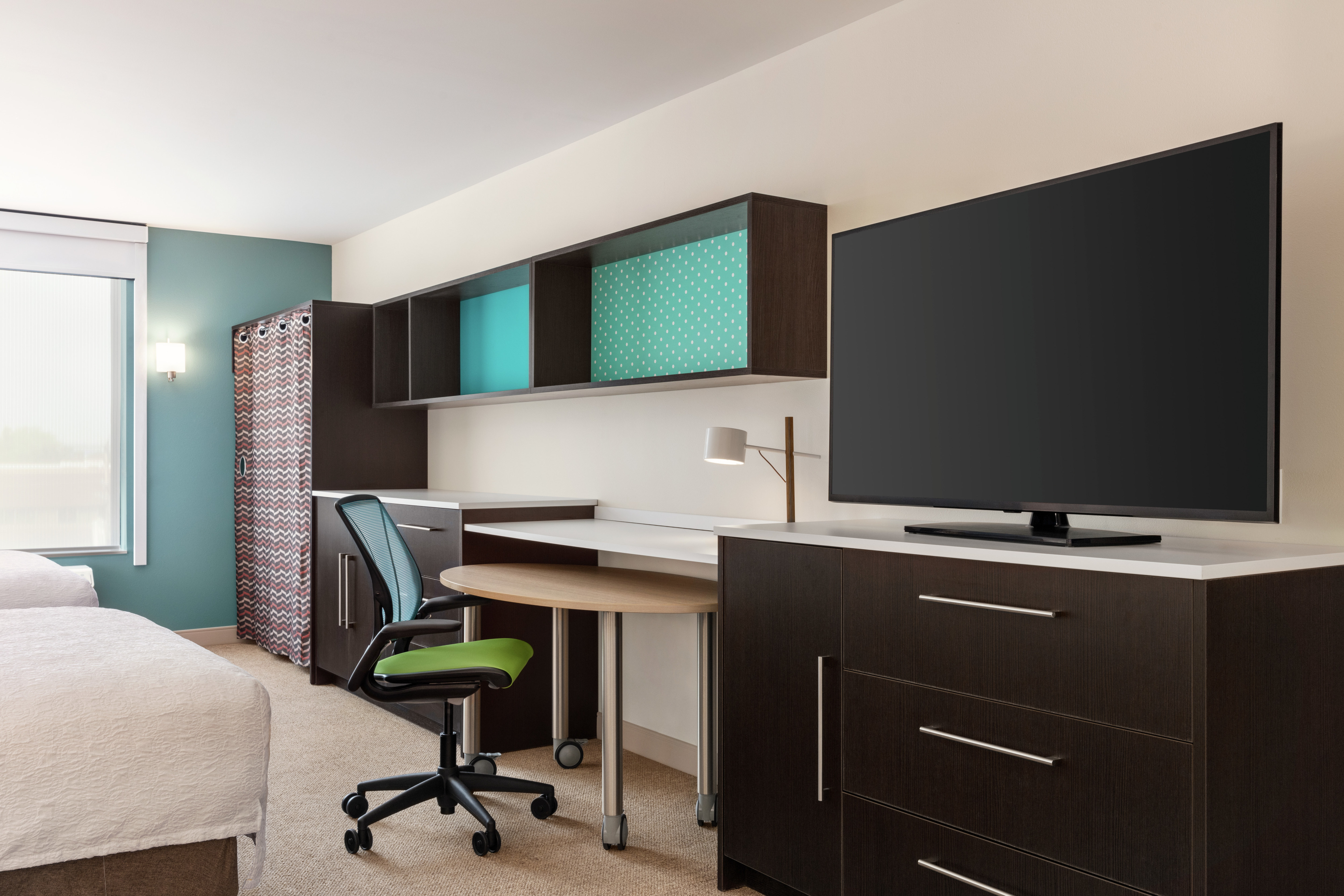 Beautiful guest suite with large TV and convenient work desk