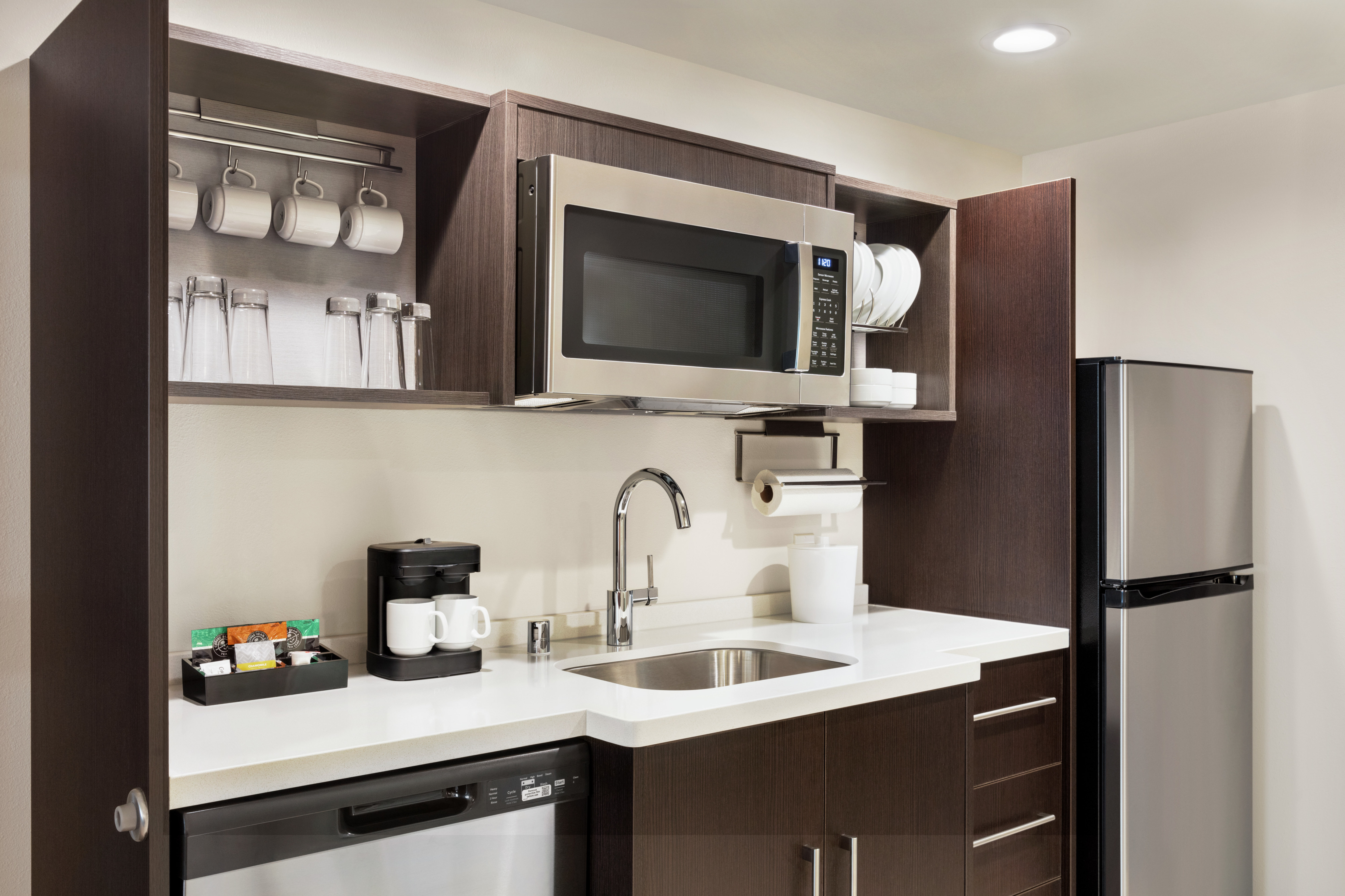 Convenient in-room kitchen with ample dish ware and modern appliances