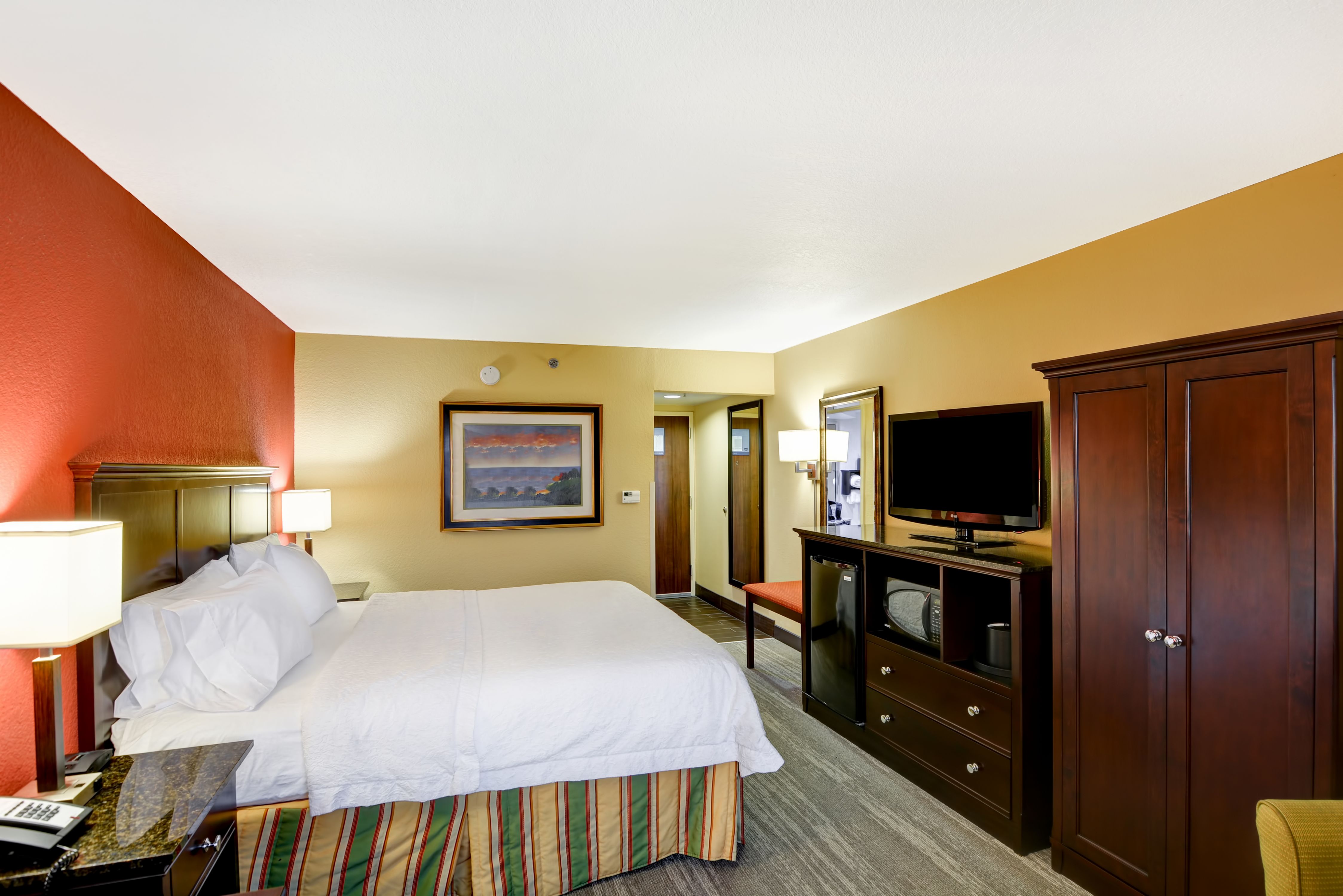 Guestroom with King Bed, Television, Mini Fridge and Microwave