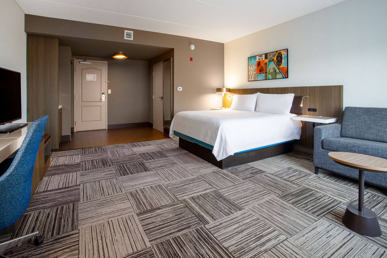 king deluxe lounge area and bed