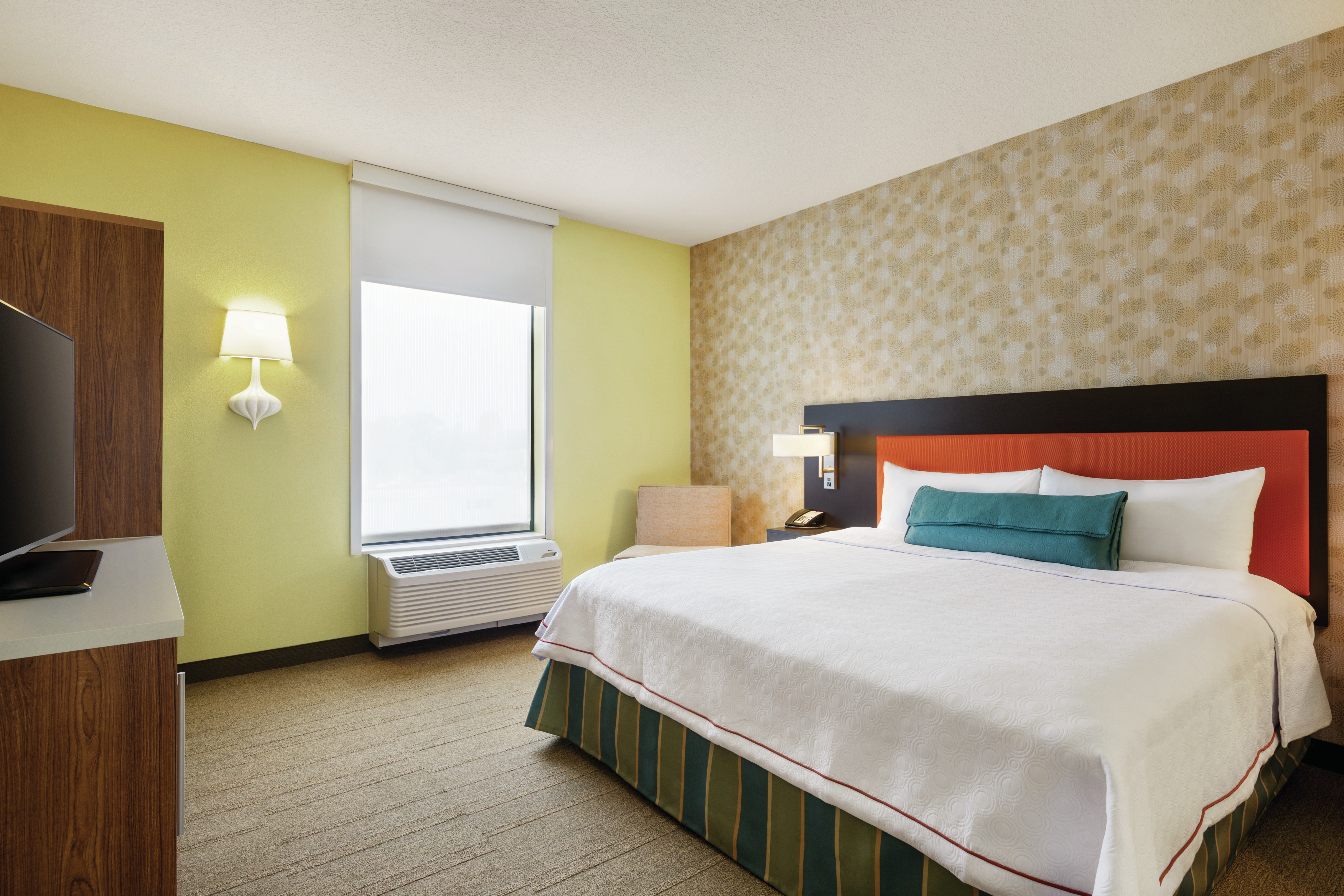 Bed with TV and radiator