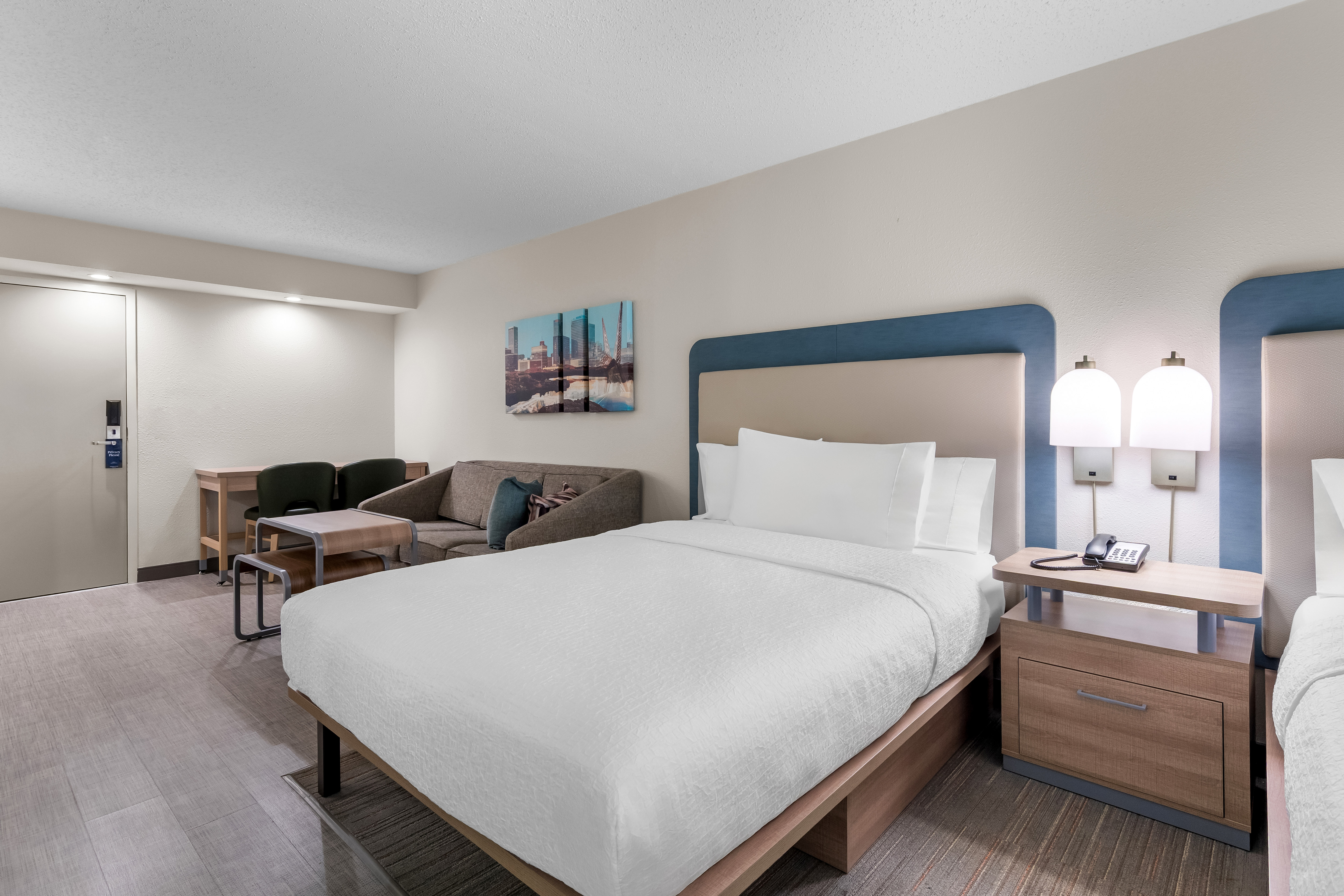 guest bedroom with double queen beds and couch area