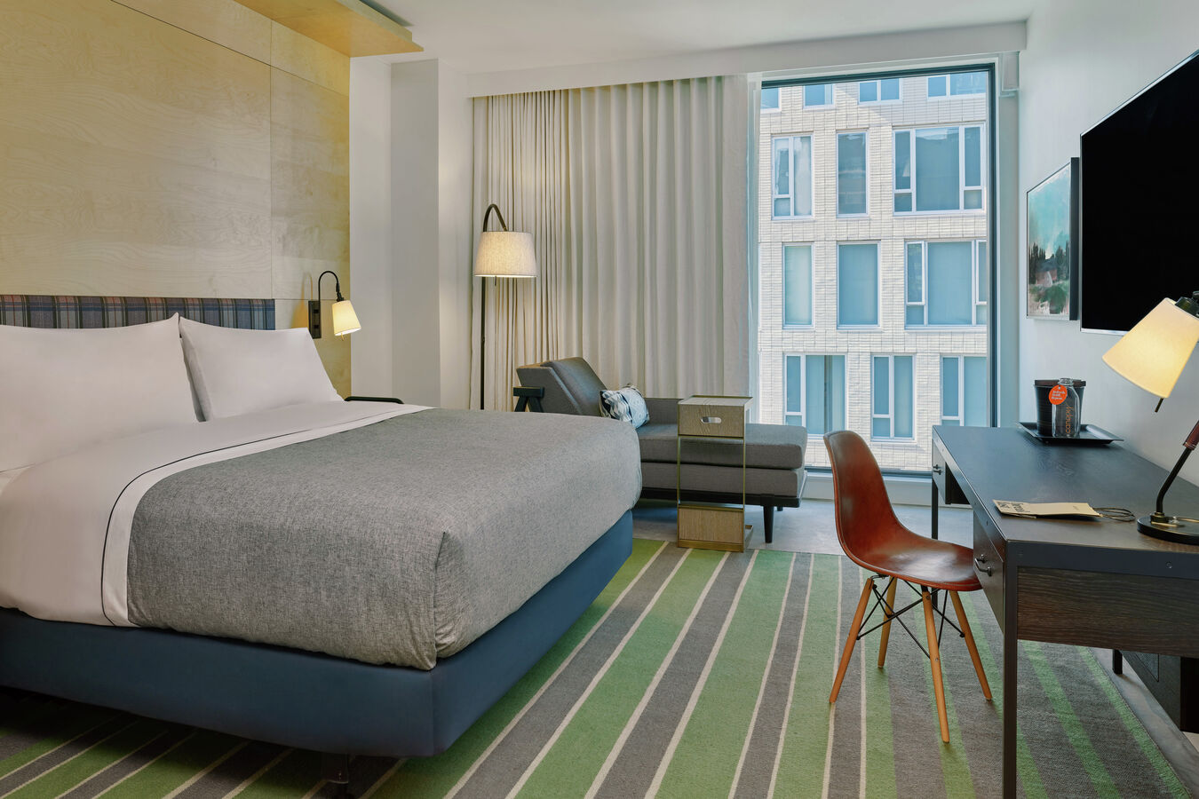Accessible Guest Room with King-Sized Bed, Work Desk with Chair, Chaise, Flat Screen TV, and Outside View