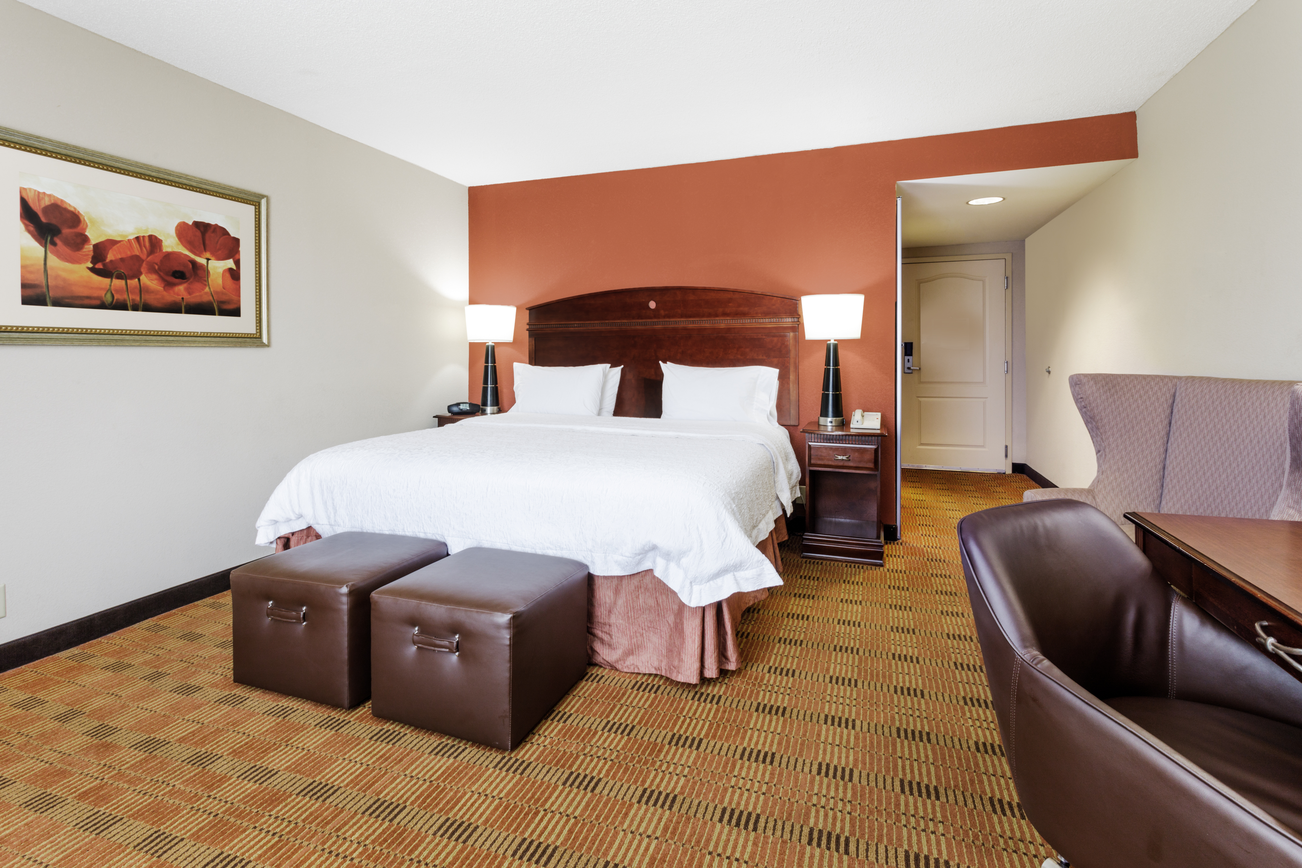 One King Bed Guest Bedroom with Work Desk, Footrests and Armchair