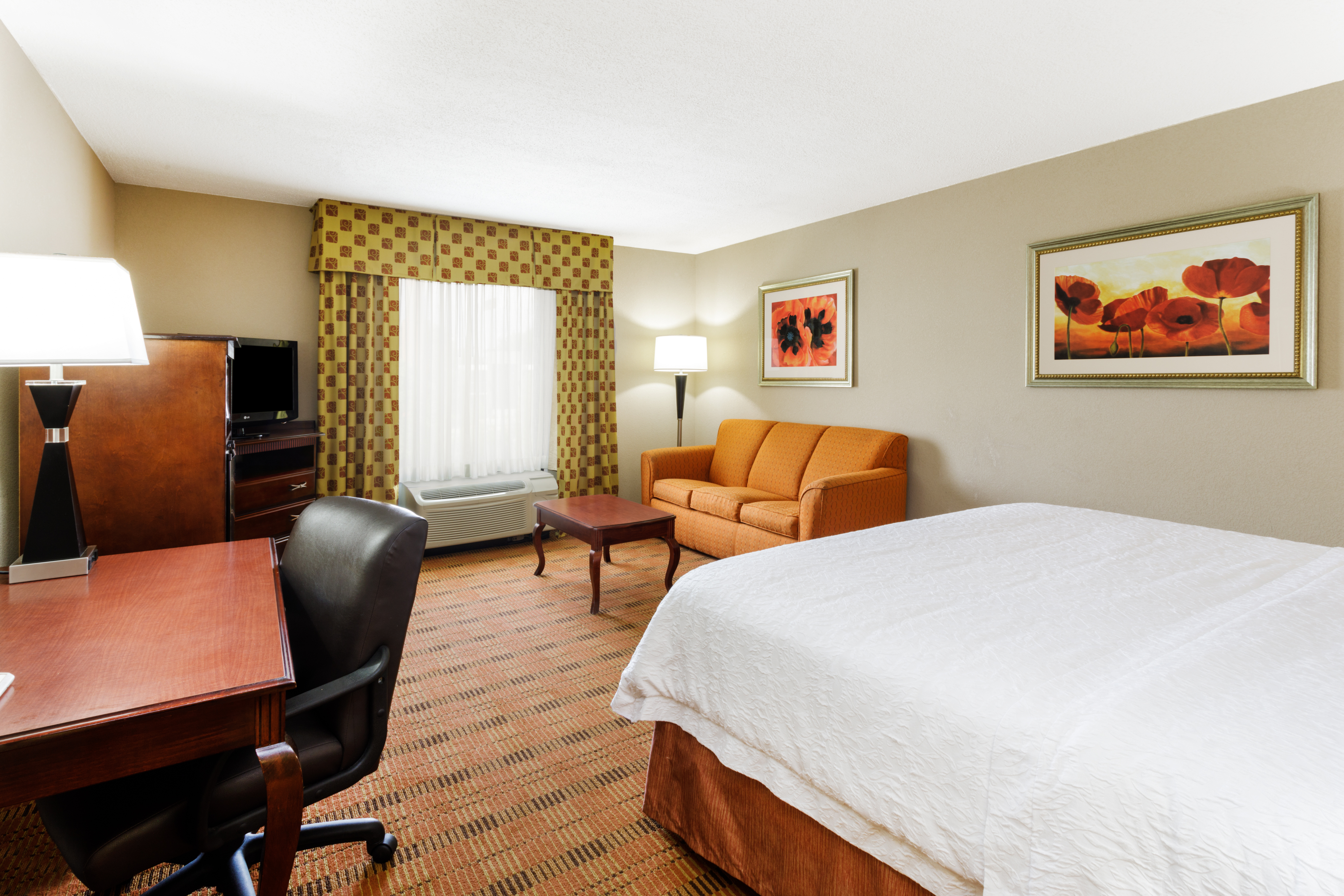 One King Bed Guest Bedroom with Work Desk, Sofa and Coffee Table