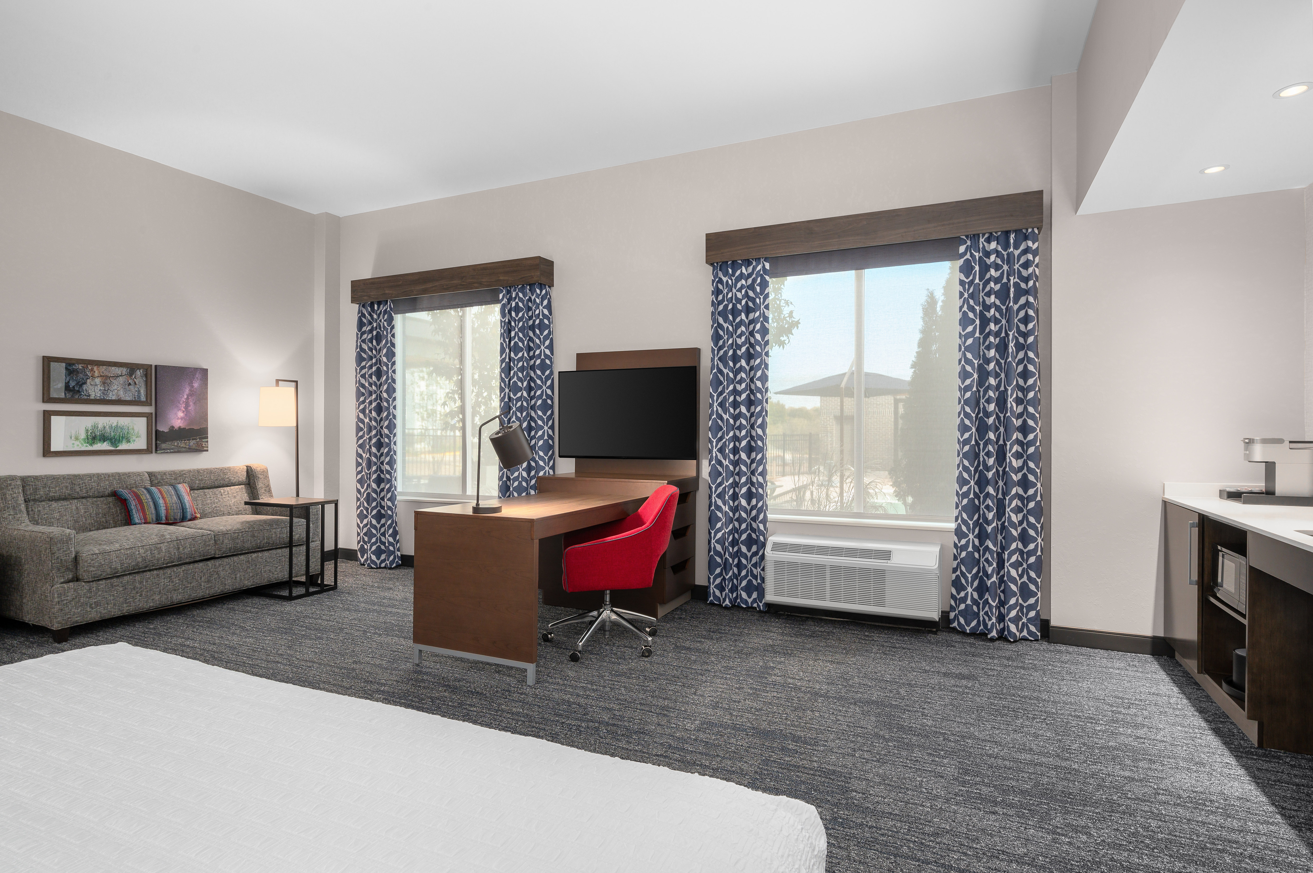 Room with a Bed, Couch, and Television