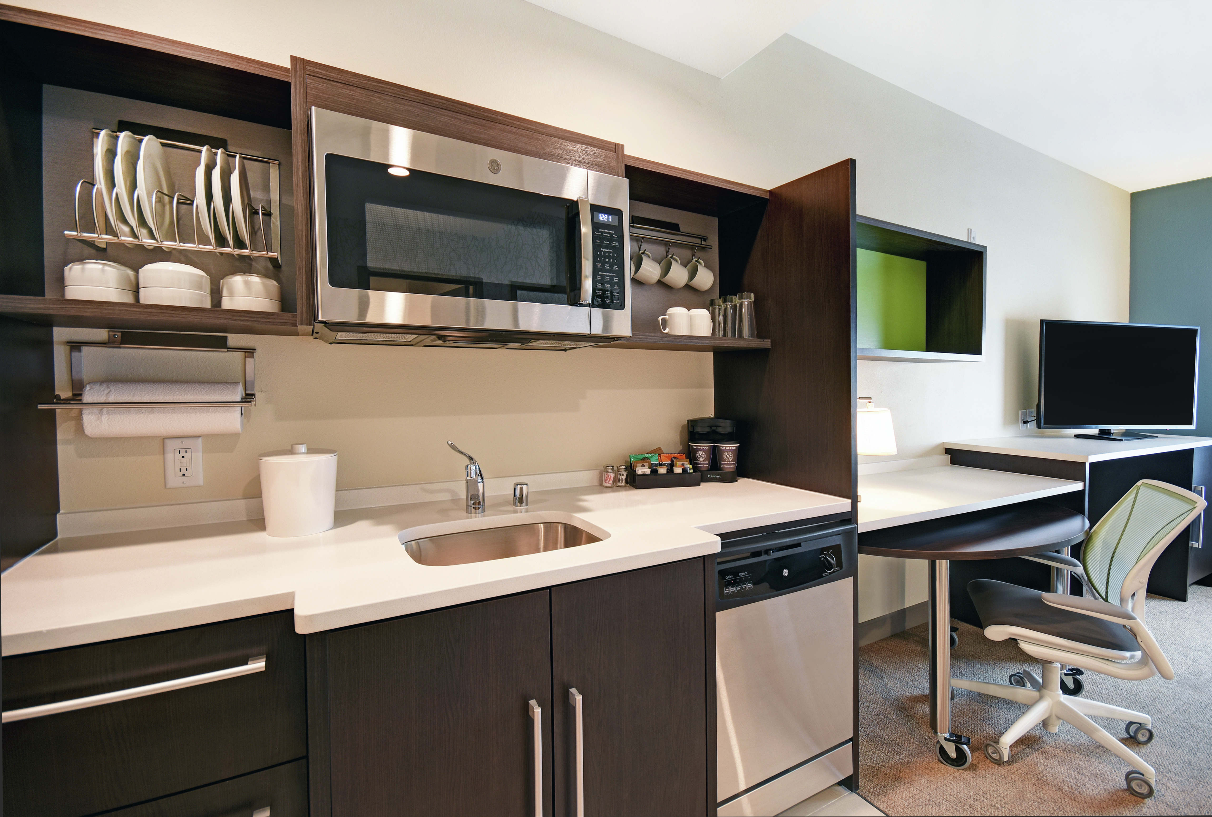 Suite Kitchen Area with Microwave Dishwasher Desk and Television