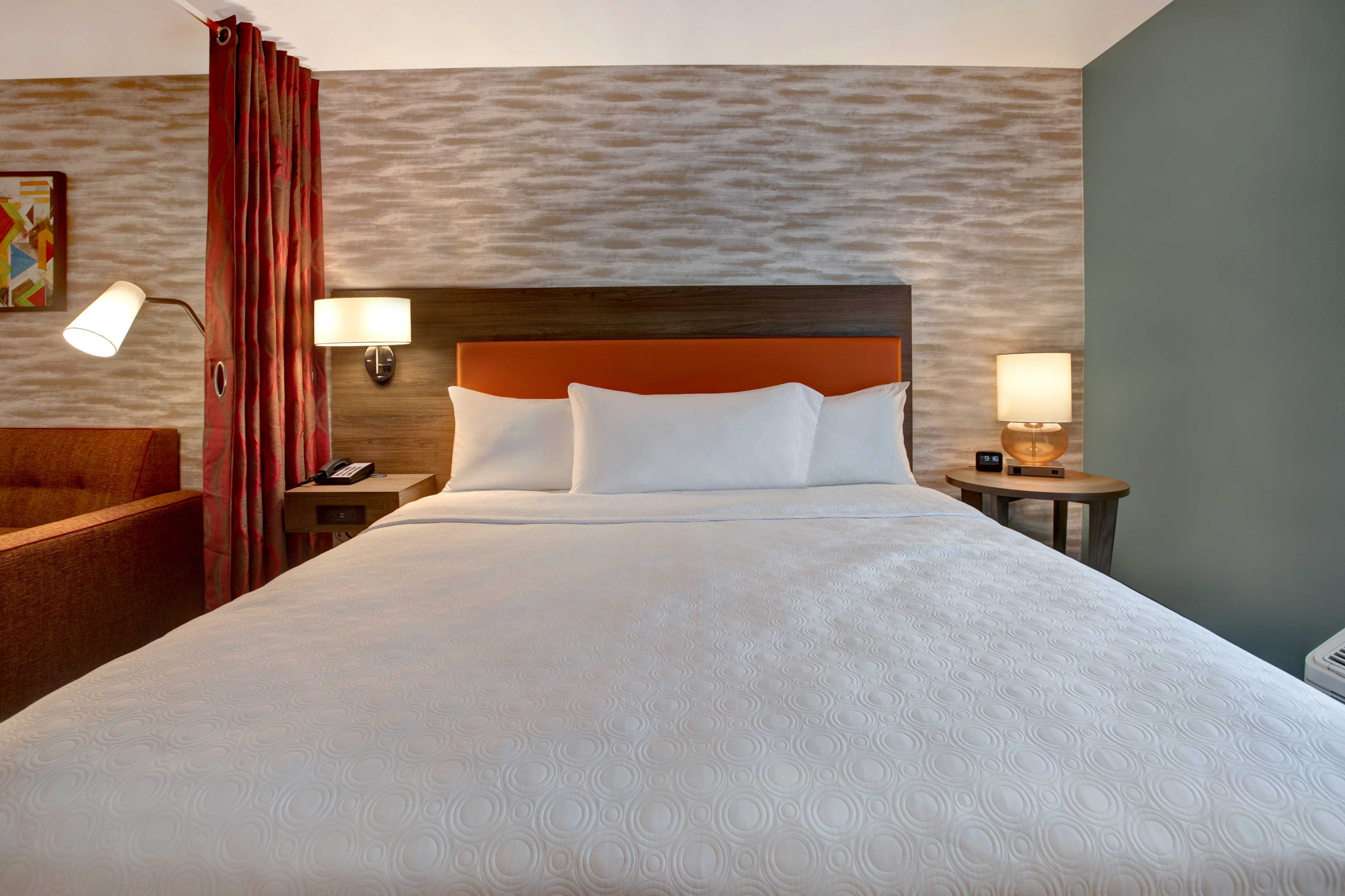 guest room with bed and side tables