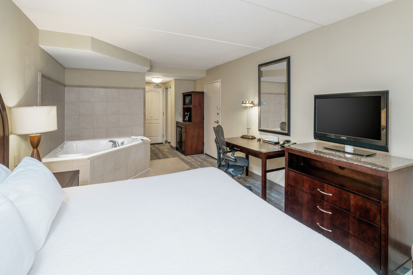 Suite with King Bed, Work Desk, Whirlpool Hot Tub, Kitchenette, and Room Technology