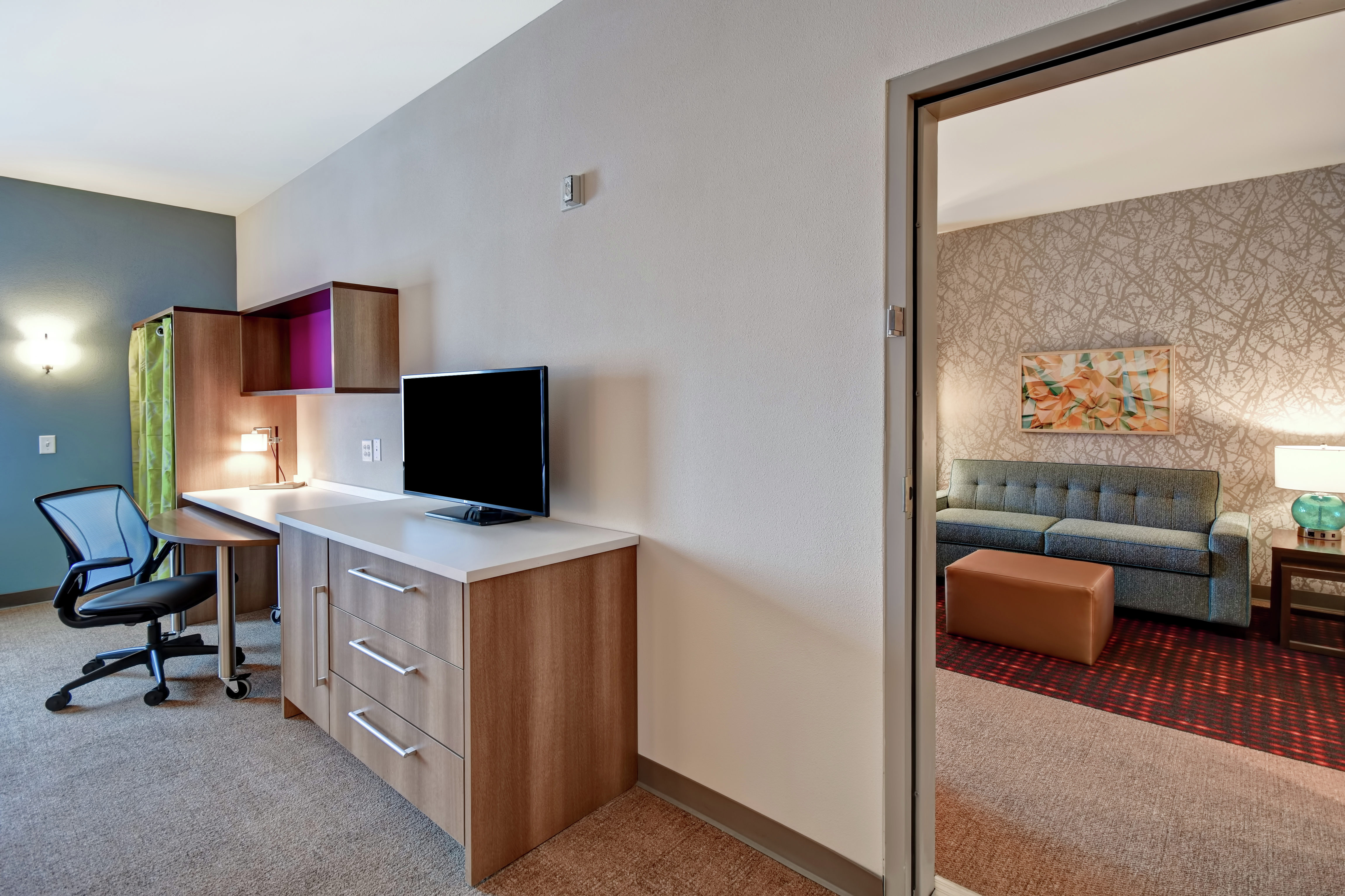 One King Suite Living Area, TV, and Work Desk