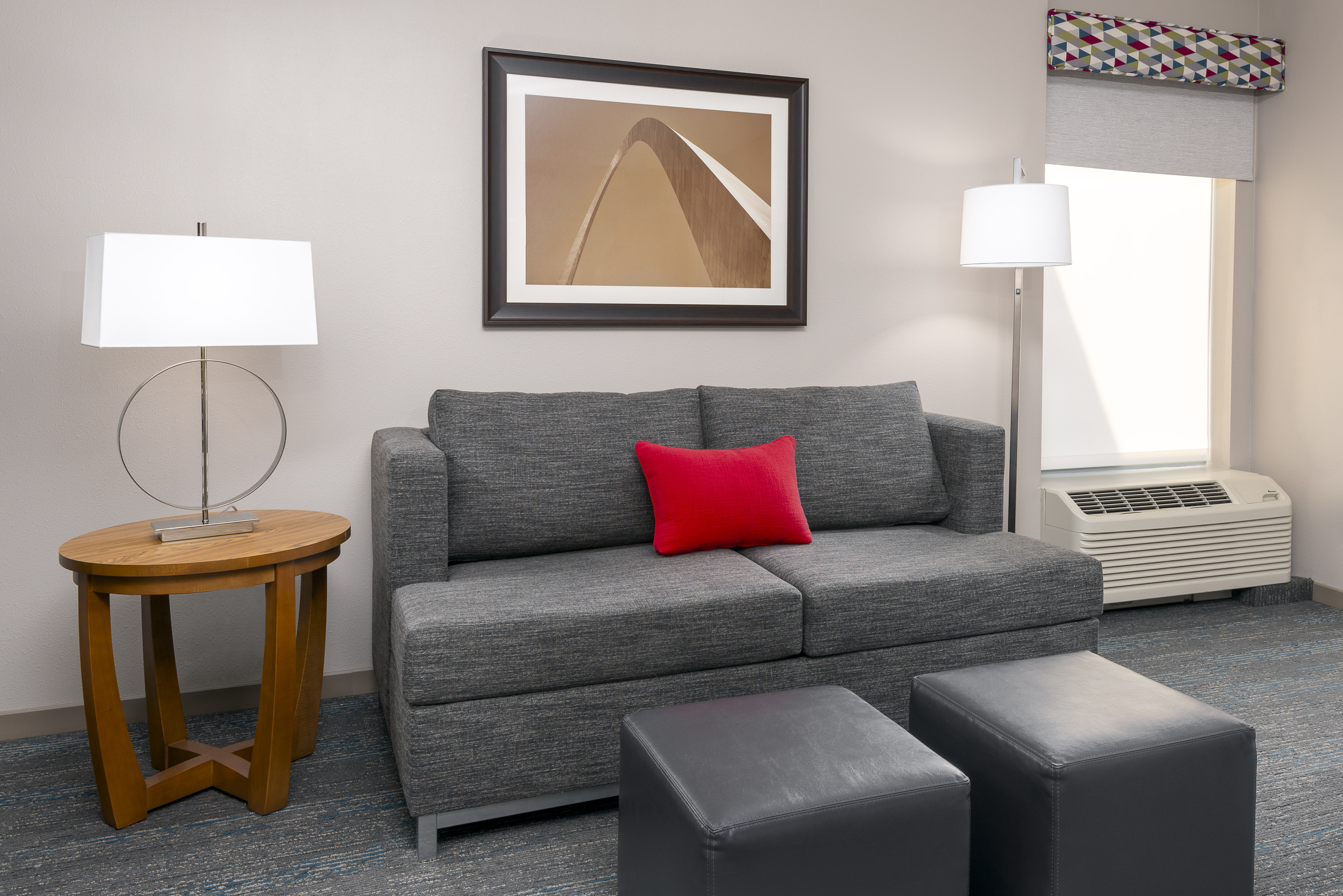 guest suite sofa, ottomans, end table