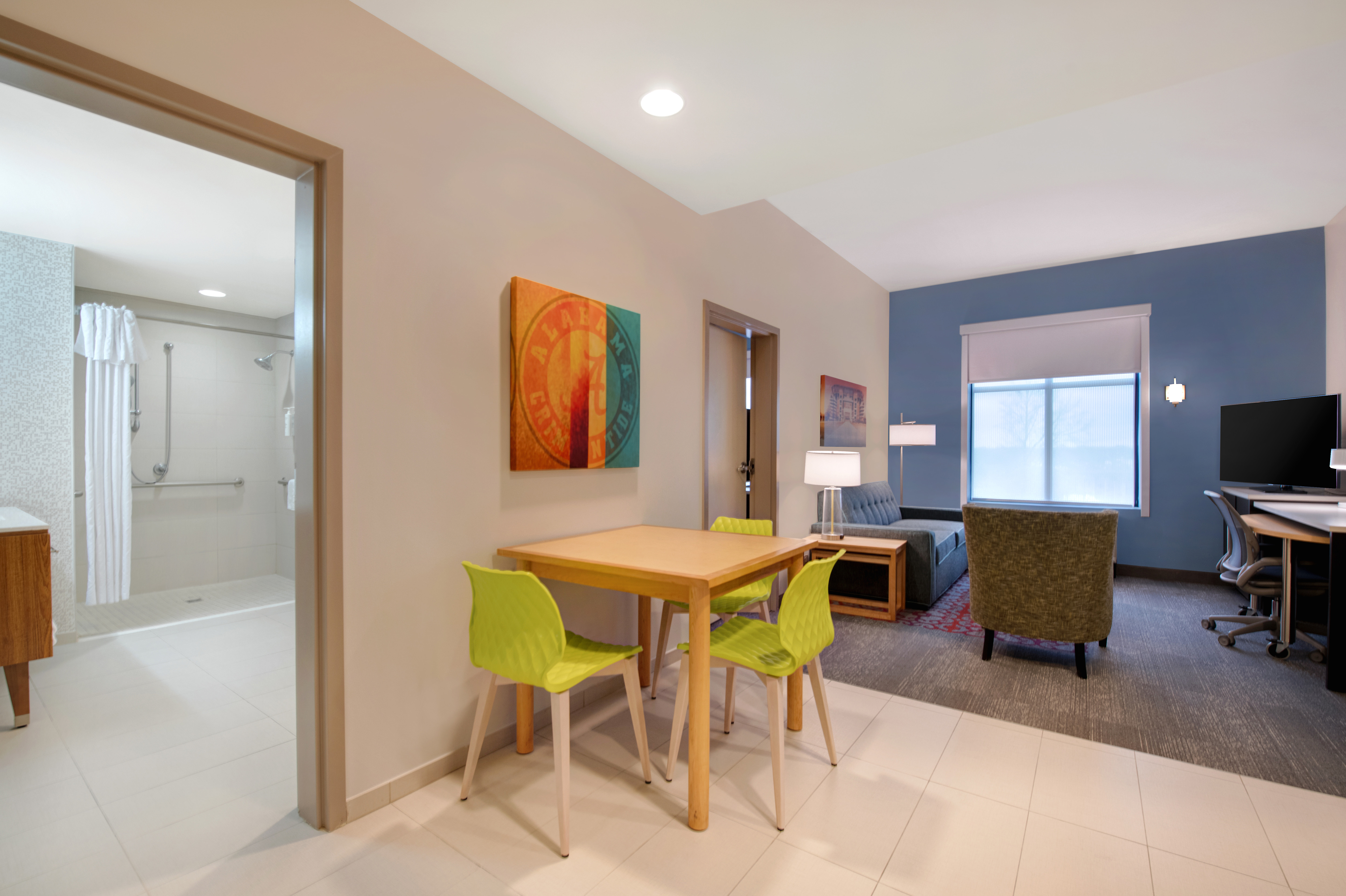 guest room with dining table and lounge area