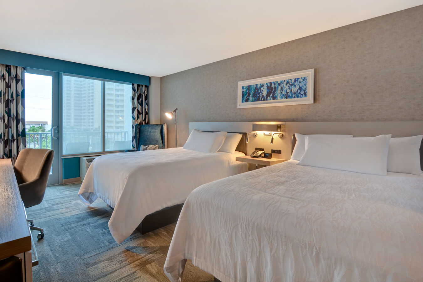 guest room with two beds and walk out to balcony