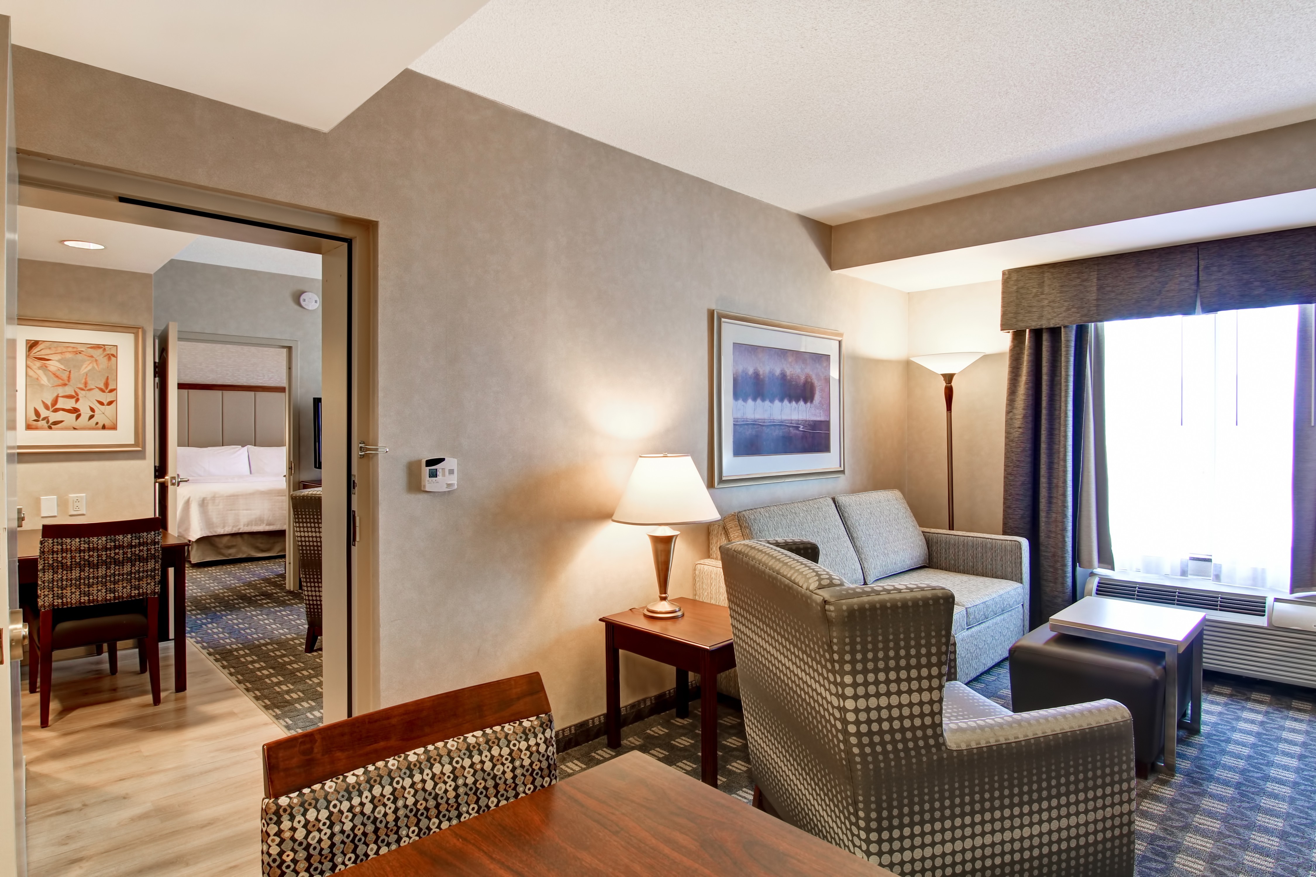 Guestroom Suite Living Area and View of Bedroom
